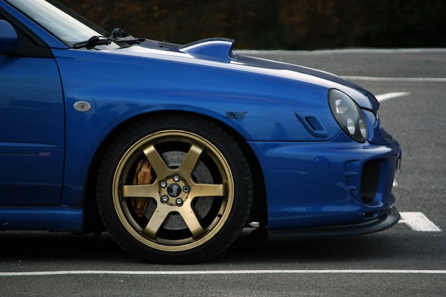 a%20blue%20car%20in%20their%20designated%20parking%20spot